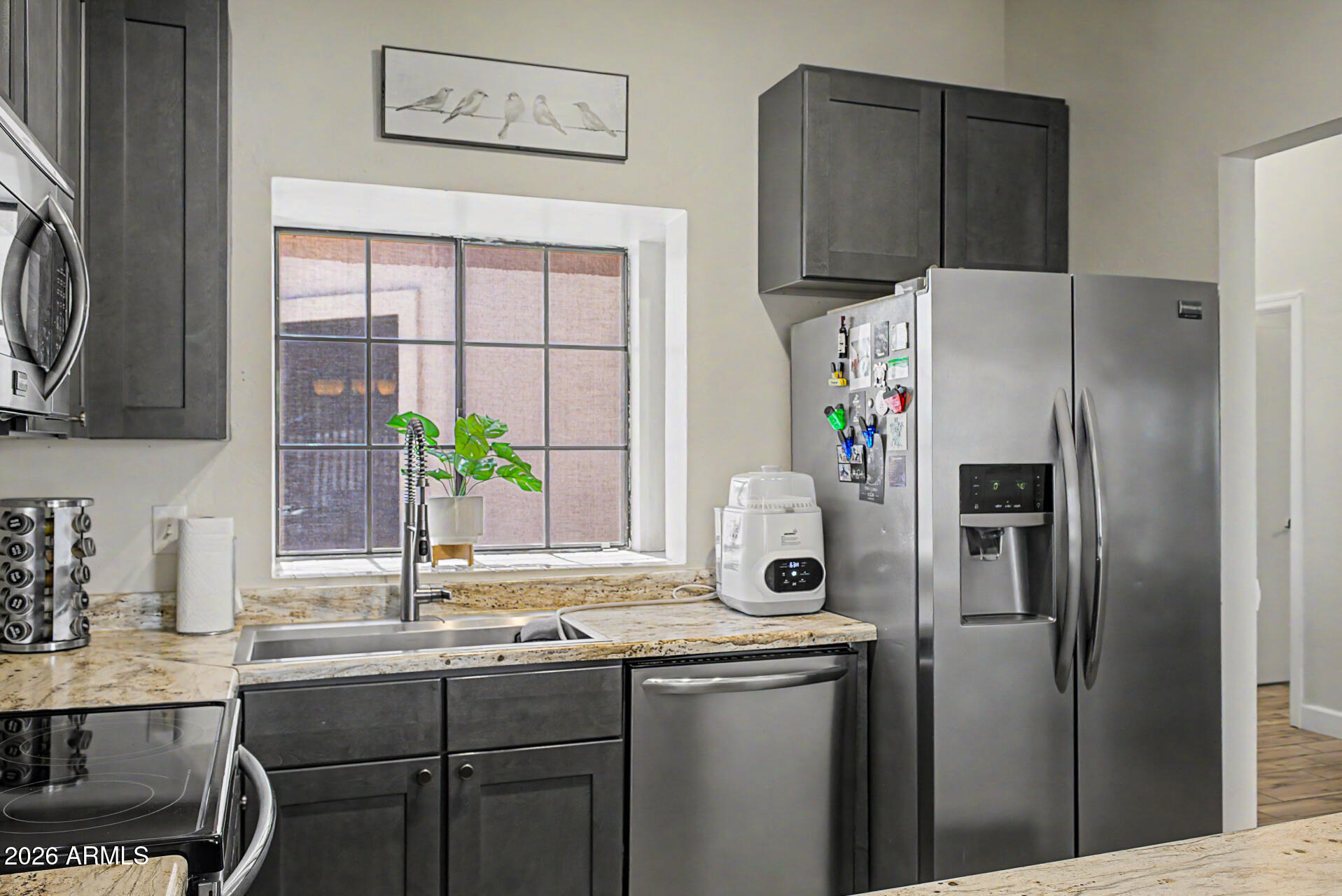 4725 East Brown Road, Unit 70 Mesa, AZ 85205 - Photo 10 of 25 a kitchen with stainless steel appliances a refrigerator and a sink
