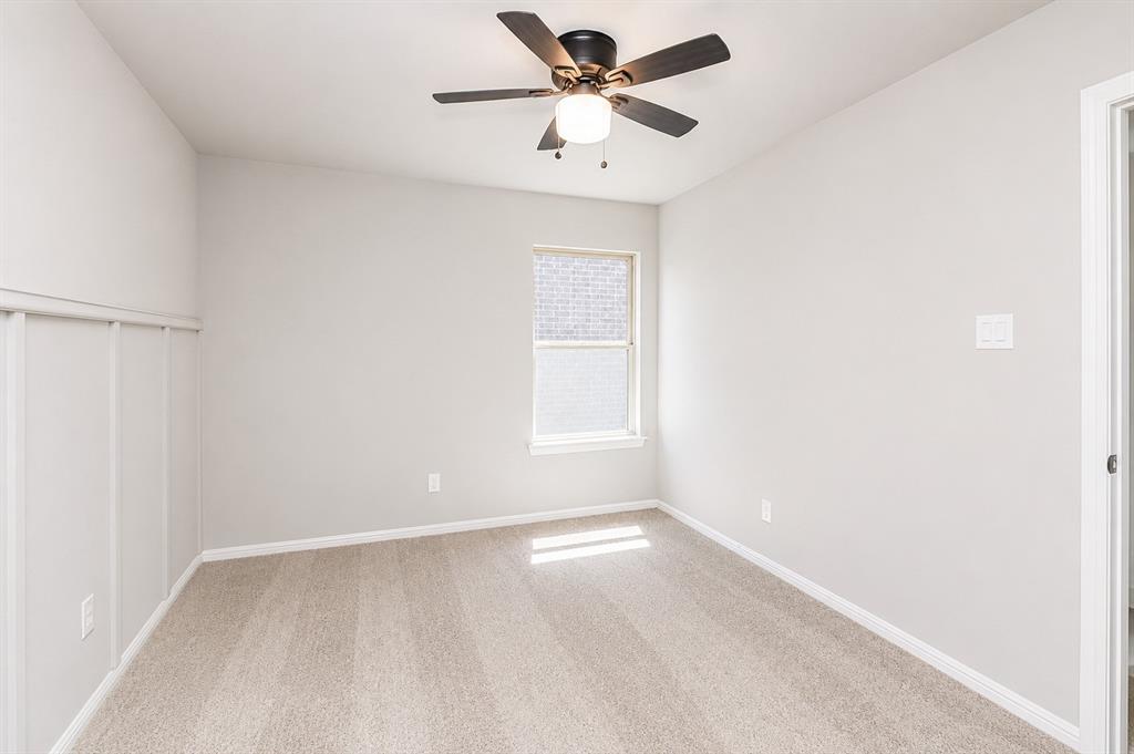 3344 Duncan Way Corinth, TX 76210 - Photo 18 of 38 Comfortable room featuring light-toned carpeting, a single window with blinds, and white trim