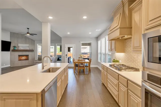 an aerial view of a house with balcony and patio
