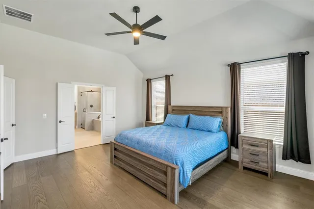 a open kitchen with stainless steel appliances granite countertop a stove and a refrigerator