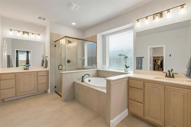 a bedroom with furniture and wooden floor
