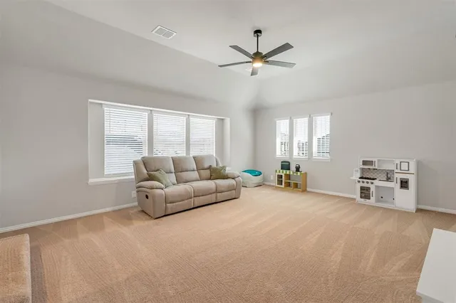 a bathroom with a granite countertop sink and a bathtub