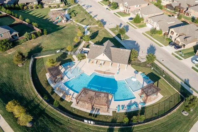 an aerial view of a house with a lake view