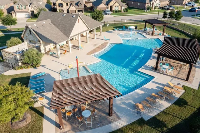 an aerial view of a house with outdoor space