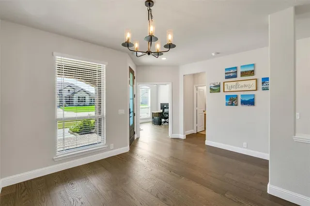 a view of a room with wooden floor staircase and windows