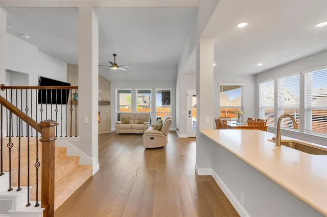 a large living room with furniture and a large window