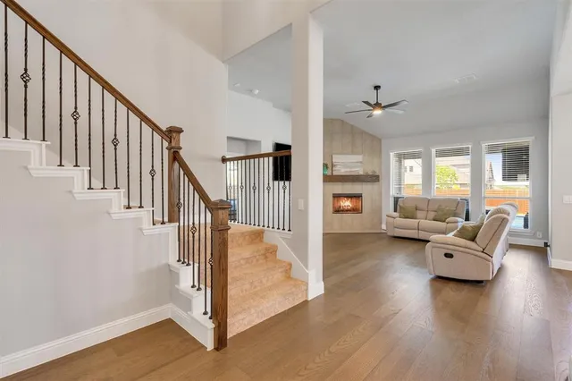 a view of entryway livingroom and hall with wooden floor