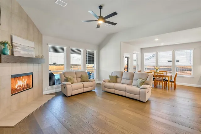 a living room with furniture and a fireplace