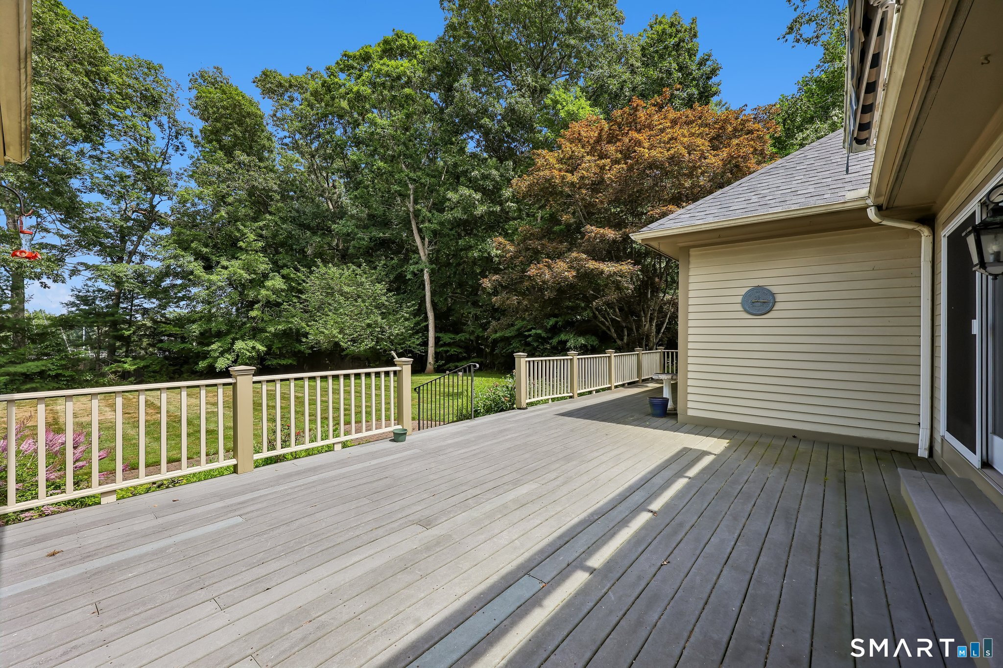 72 Strawberry Hill Road Madison, CT 06443 - Photo 17 of 40 The deck is wide and there's an awning for those really sunny days