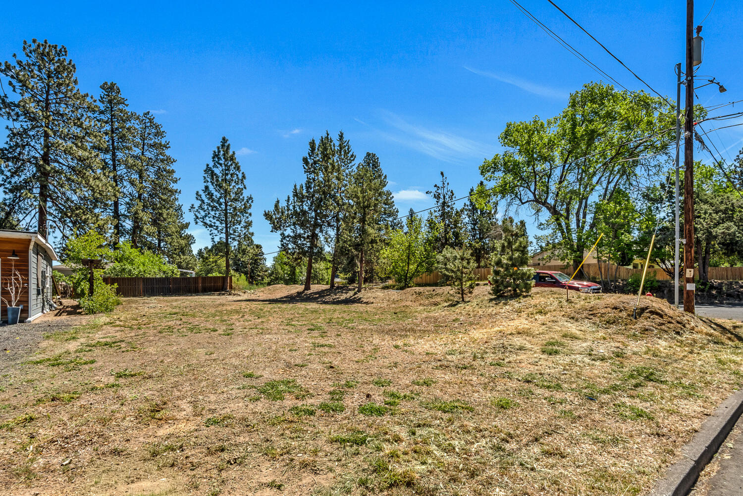 608 Northeast 10th Street Bend, OR 97701 - Photo 3 of 17 a view of a yard with a tree