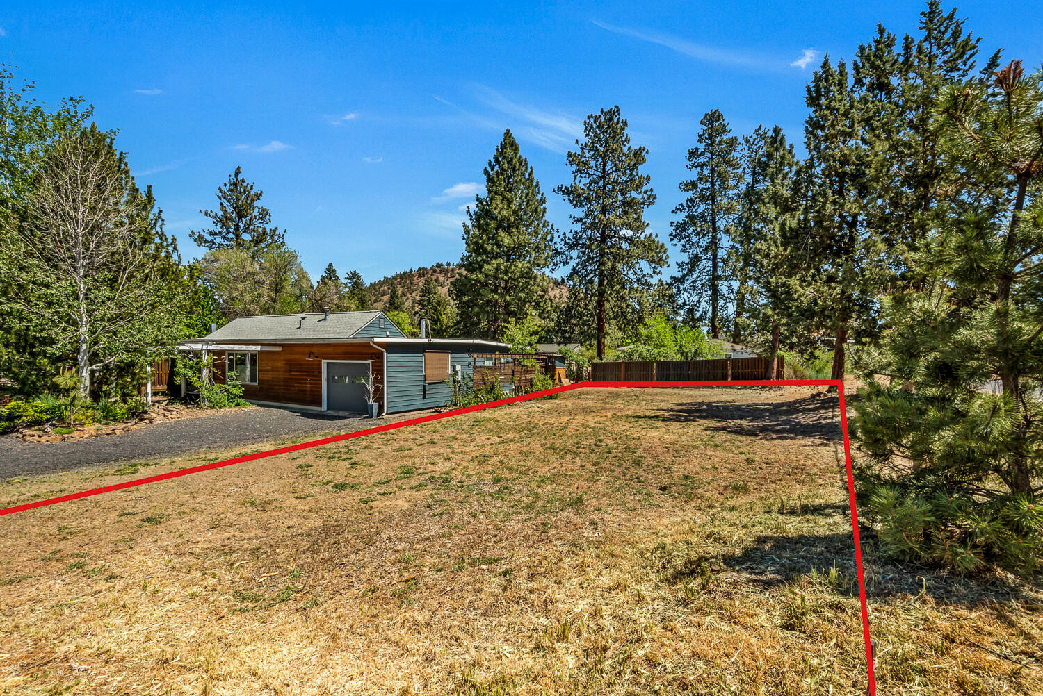 608 Northeast 10th Street Bend, OR 97701 - Photo 4 of 17 a view of a house with backyard and trees