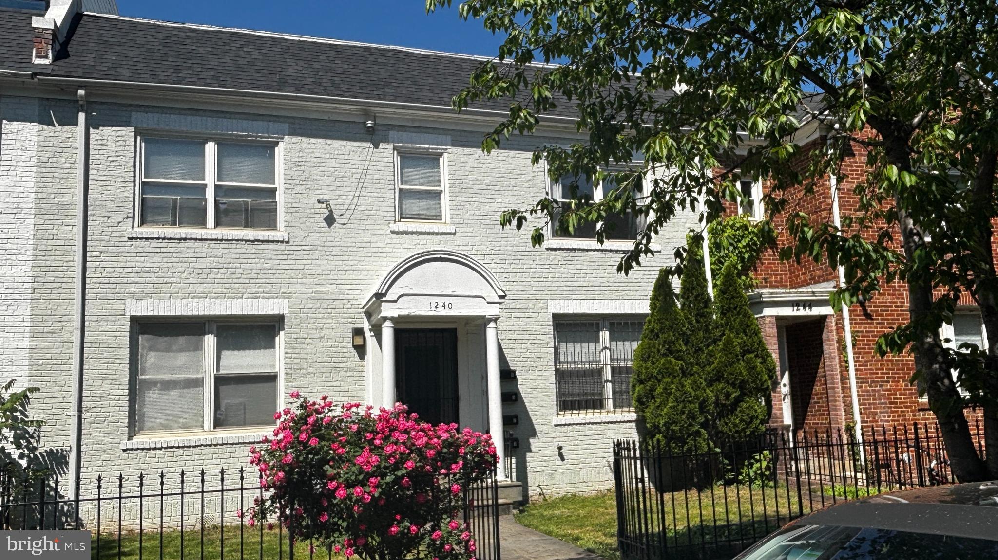 1240 18th Street Northeast, Unit 2 Washington, DC 20002 - Photo 1 of 11 a front view of a house with a garden