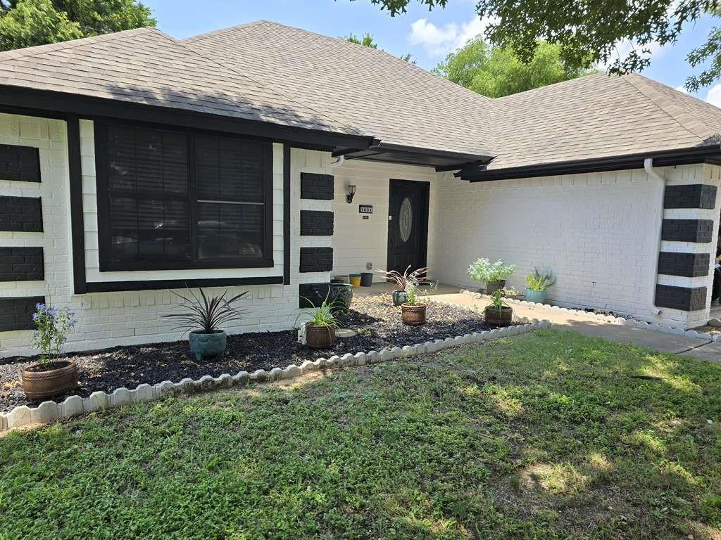 1631 Stratford Lane Duncanville, TX 75137 - Photo 2 of 9 a front view of a house with a yard