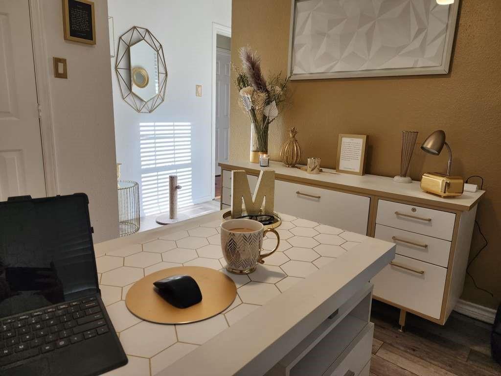 1631 Stratford Lane Duncanville, TX 75137 - Photo 5 of 9 a kitchen with a table chairs and a stove