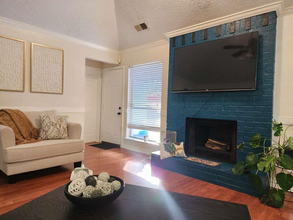 1631 Stratford Lane Duncanville, TX 75137 - Photo 7 of 9 a living room with furniture and a fireplace