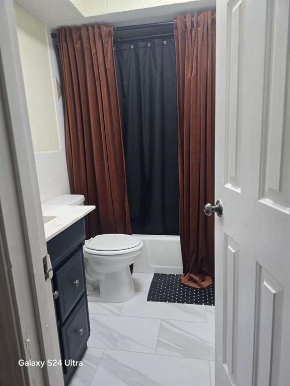 1631 Stratford Lane Duncanville, TX 75137 - Photo 9 of 9 a bathroom with a sink a toilet a tub and shower