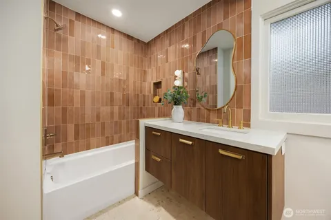 a bathroom with a double vanity sink and a mirror