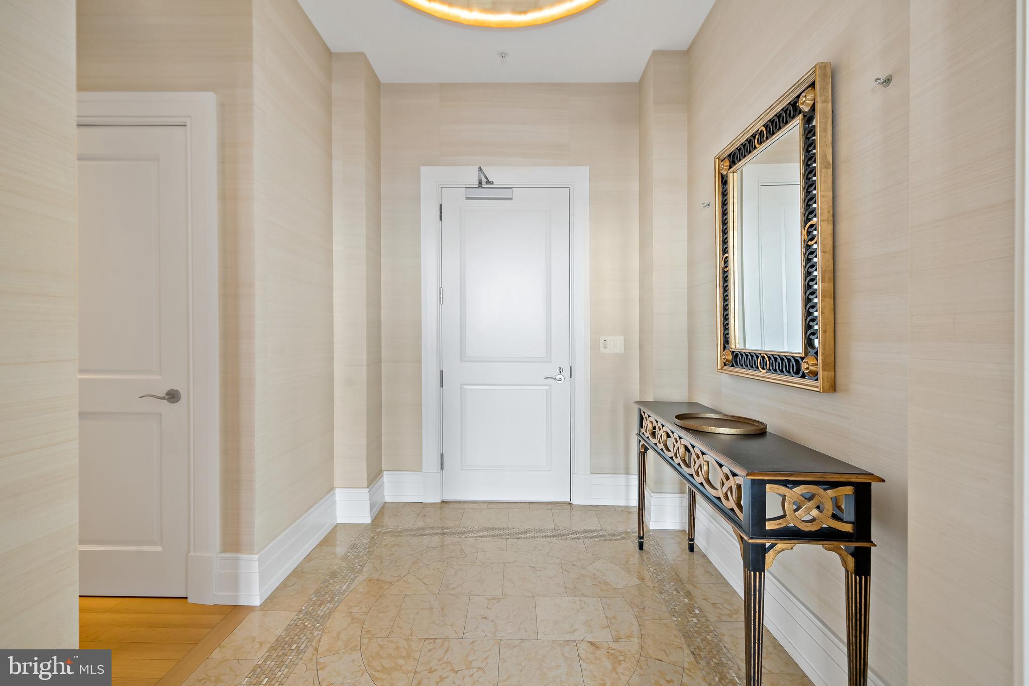 130 South 18th Street, Unit 3102 Philadelphia, PA 19103 - Photo 37 of 43 Entry Vestibule with Coat Closet and Powder Room