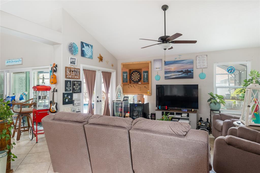 1301 Monte Lake Drive Valrico, FL 33596 - Photo 13 of 36 a living room with furniture and a flat screen tv