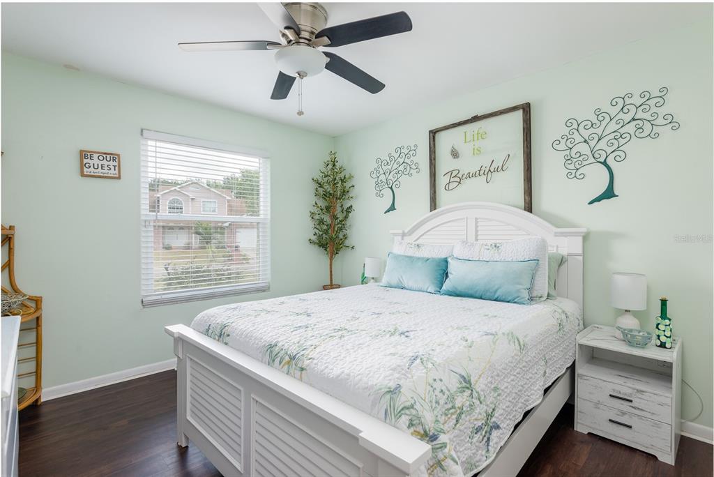 1301 Monte Lake Drive Valrico, FL 33596 - Photo 16 of 36 a bedroom with a large bed and a window