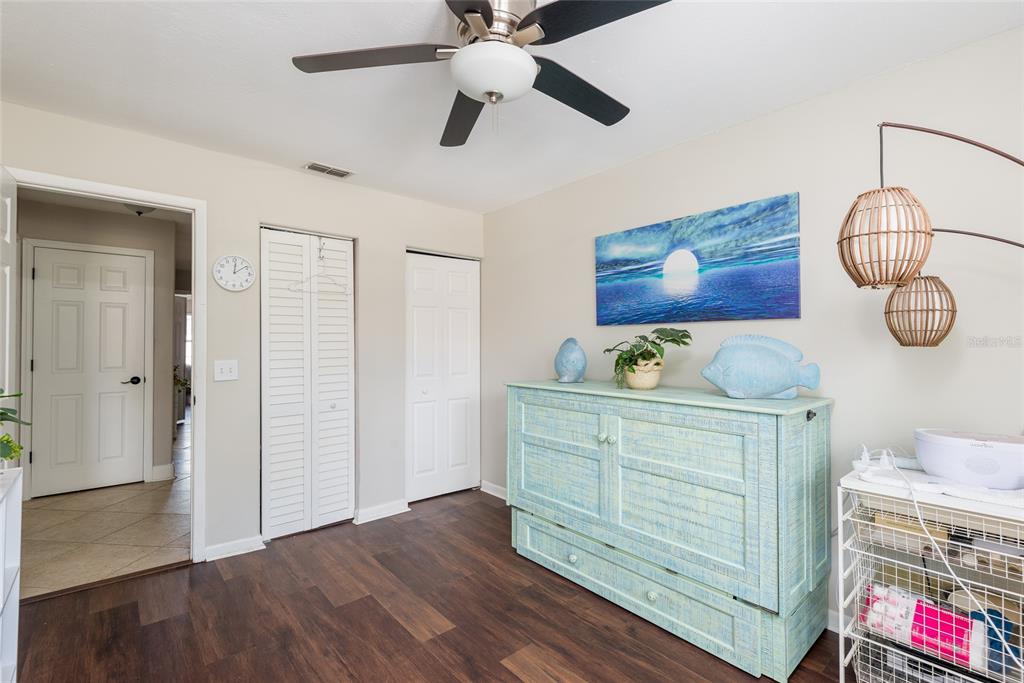 1301 Monte Lake Drive Valrico, FL 33596 - Photo 20 of 36 a view of a hallway with wooden floor