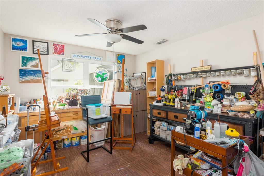 1301 Monte Lake Drive Valrico, FL 33596 - Photo 21 of 36 a view of a workspace with furniture and toys