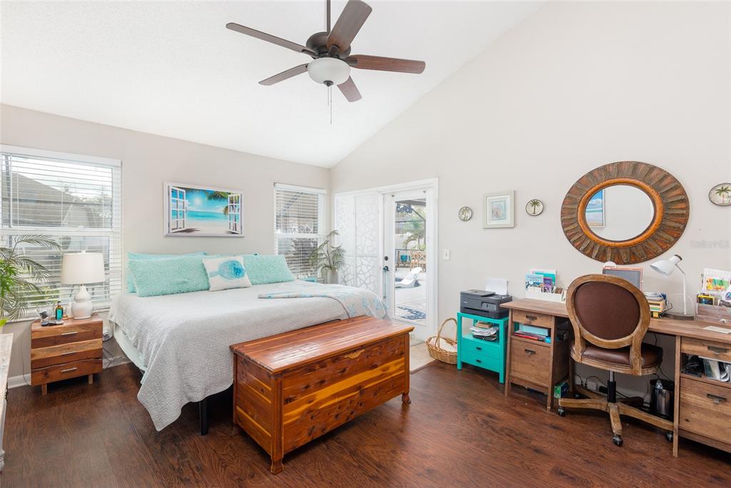 1301 Monte Lake Drive Valrico, FL 33596 - Photo 24 of 36 a bedroom with a bed a dresser and a window