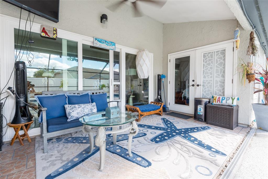 1301 Monte Lake Drive Valrico, FL 33596 - Photo 29 of 36 a living room with furniture and a floor to ceiling window