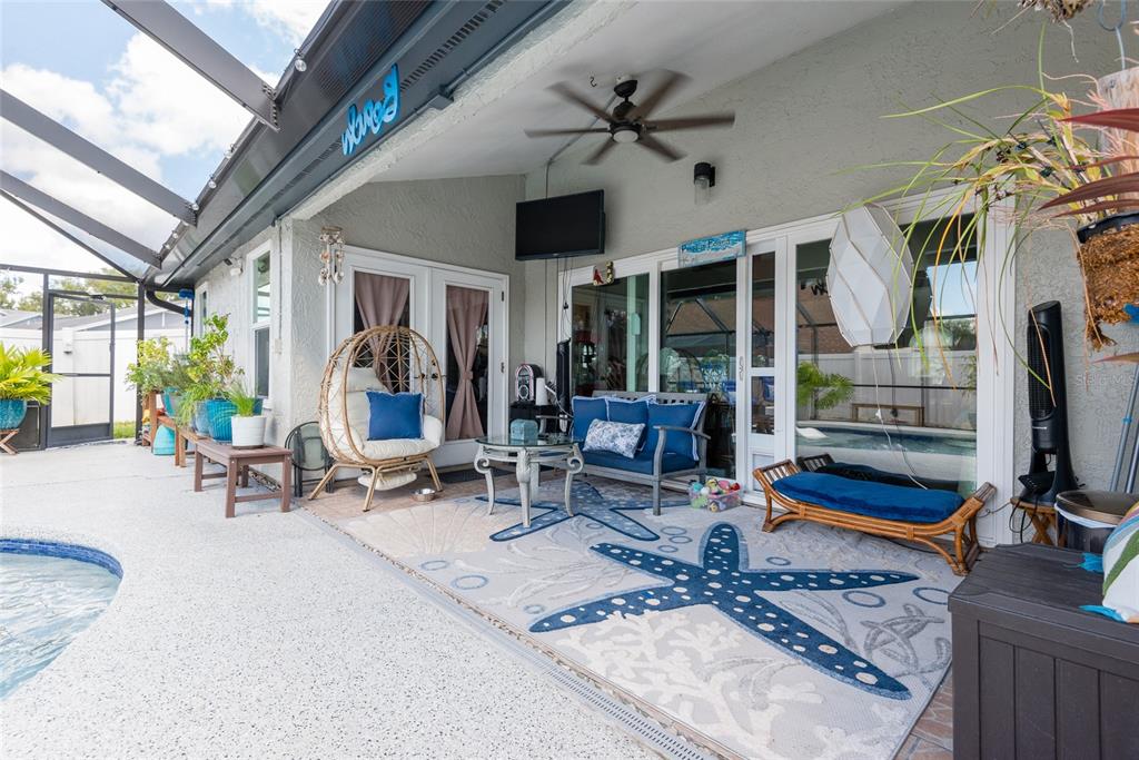 1301 Monte Lake Drive Valrico, FL 33596 - Photo 30 of 36 a living room with furniture a flat screen tv and a large window