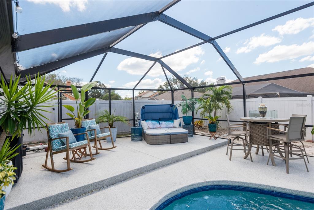 1301 Monte Lake Drive Valrico, FL 33596 - Photo 31 of 36 a dining room with furniture water view and a floor to ceiling window