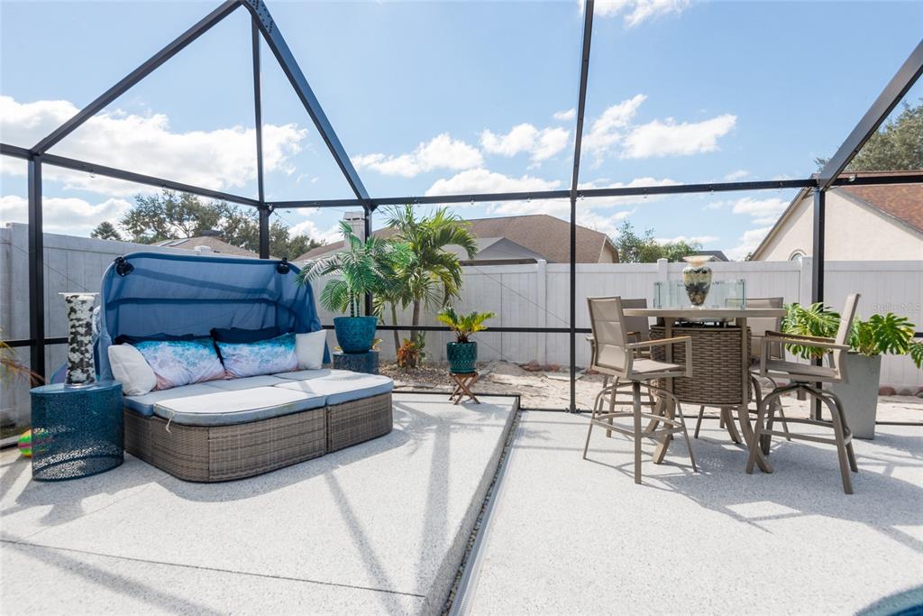 1301 Monte Lake Drive Valrico, FL 33596 - Photo 32 of 36 a living room with patio furniture and a floor to ceiling window