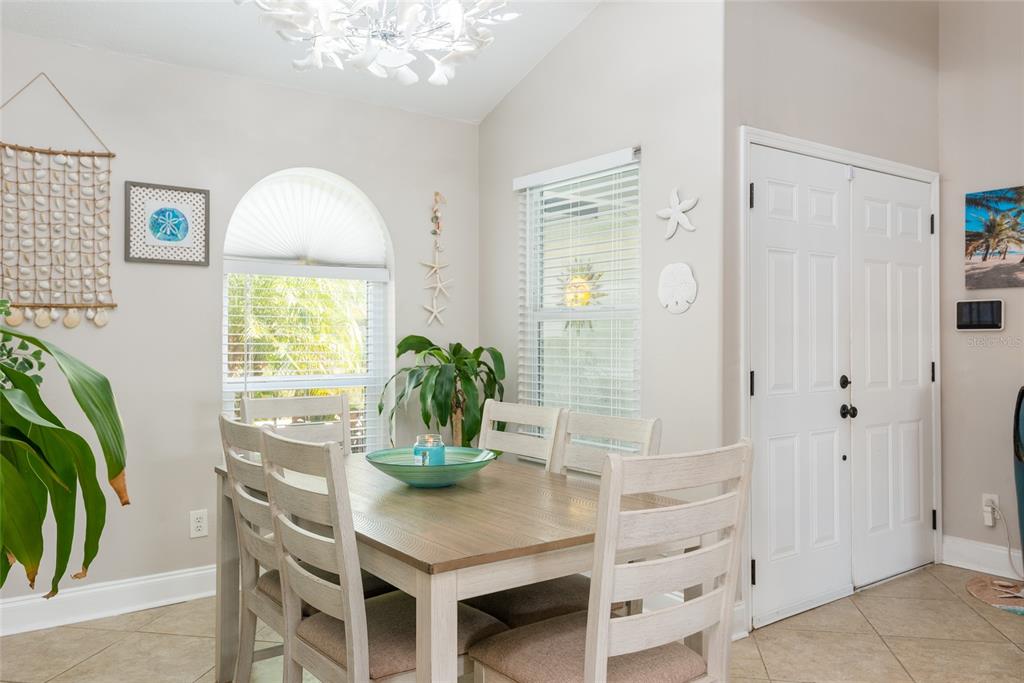 1301 Monte Lake Drive Valrico, FL 33596 - Photo 5 of 36 a view of a dining room with furniture and a potted plant