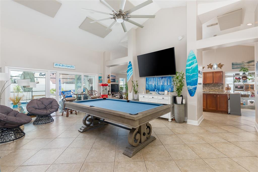 1301 Monte Lake Drive Valrico, FL 33596 - Photo 8 of 36 a living room with furniture a flat screen tv and kitchen view
