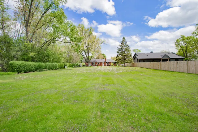 a view of a garden with a building