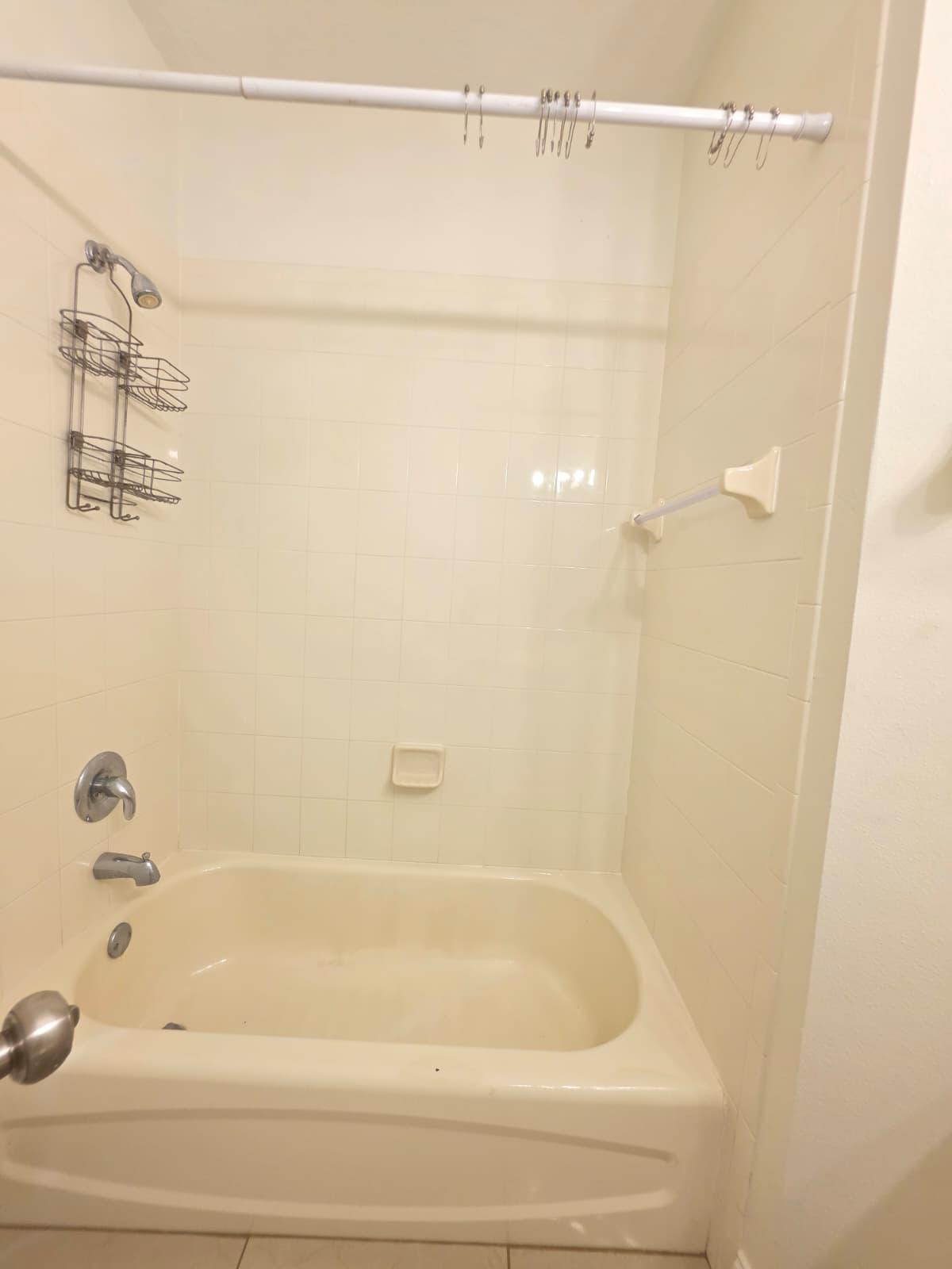 8262 Mulligan Circle, Unit 2613 SIDE B Port St. Lucie, FL 34986 - Photo 11 of 13 a bathroom with a shower and a bath tub