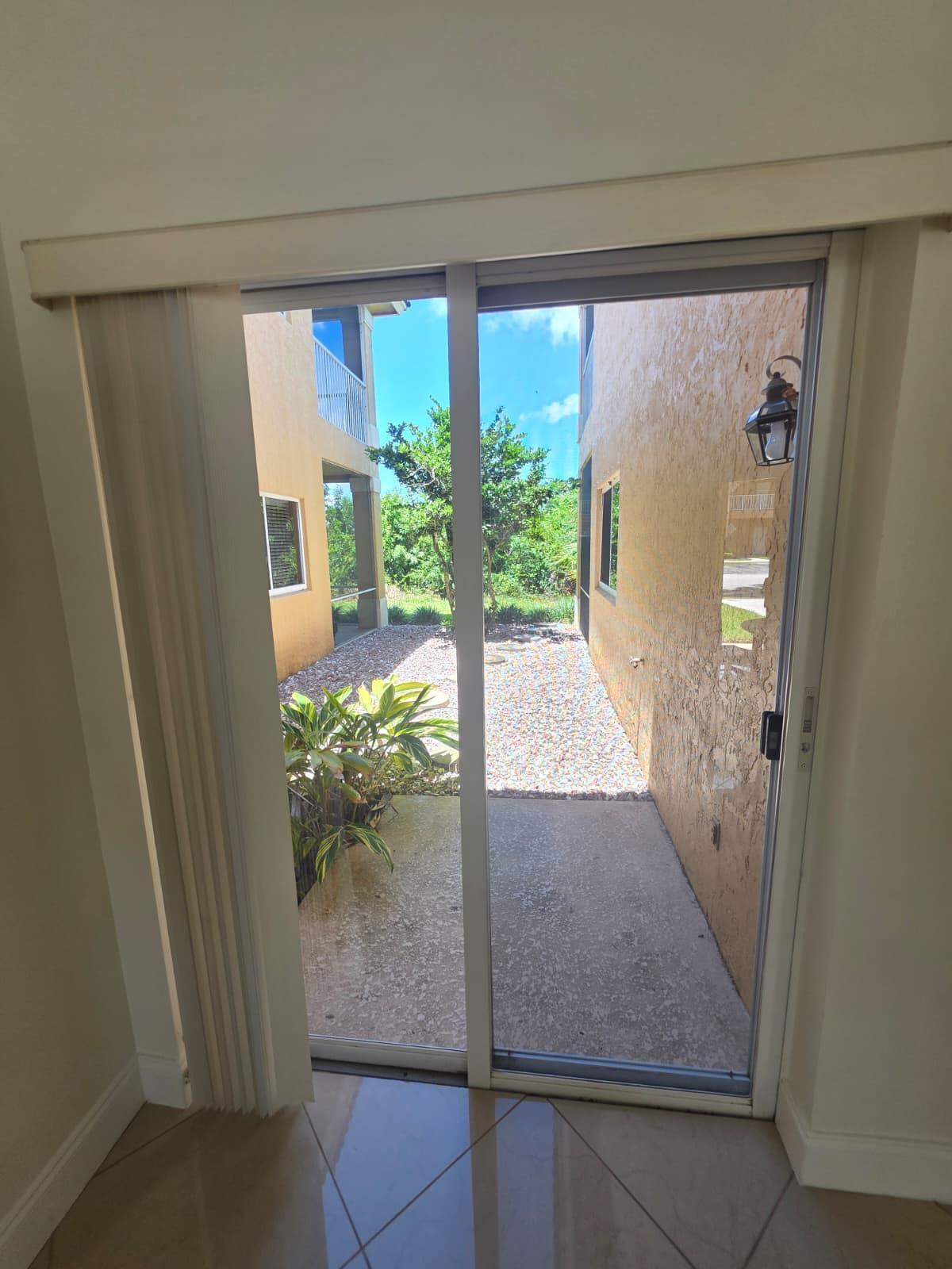 8262 Mulligan Circle, Unit 2613 SIDE B Port St. Lucie, FL 34986 - Photo 12 of 13 a view of a hallway with windows