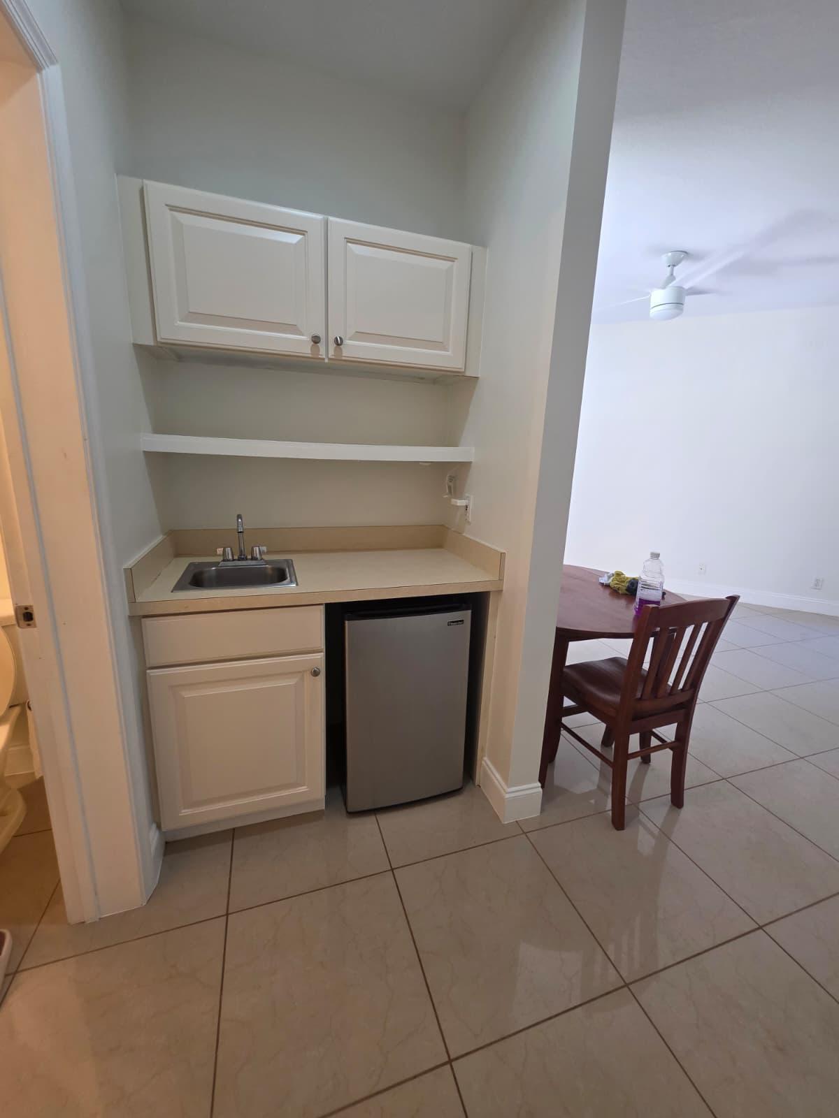 8262 Mulligan Circle, Unit 2613 SIDE B Port St. Lucie, FL 34986 - Photo 7 of 13 a utility room with dryer and washer