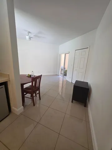 a bathroom with a sink a toilet a mirror and vanity