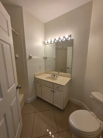 a bathroom with a shower and a bath tub