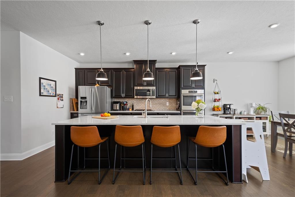 217 Sonni Lane McKees Rocks, PA 15136 - Photo 14 of 34 a large kitchen with a table and chairs