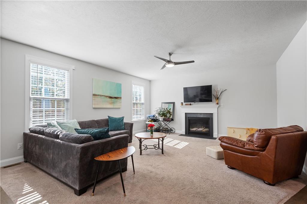 217 Sonni Lane McKees Rocks, PA 15136 - Photo 18 of 34 a living room with furniture a fireplace and a flat screen tv