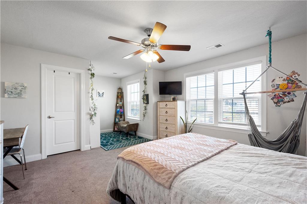 217 Sonni Lane McKees Rocks, PA 15136 - Photo 21 of 34 a bedroom with a bed and a chandelier