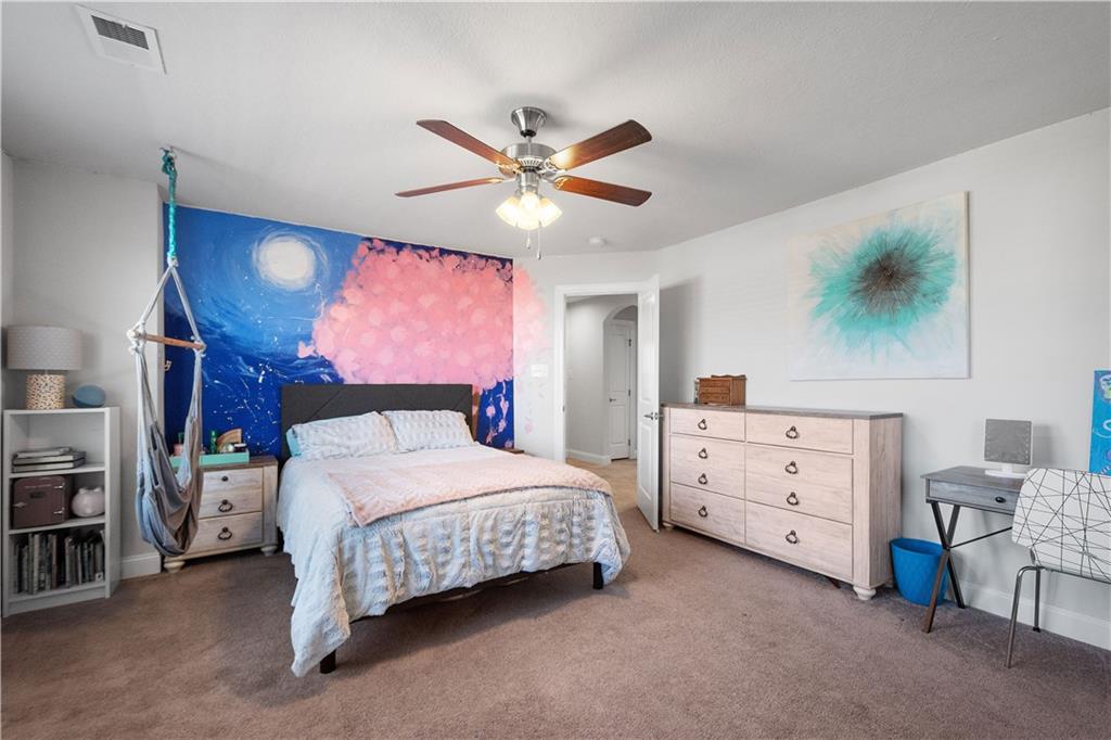 217 Sonni Lane McKees Rocks, PA 15136 - Photo 23 of 34 a bedroom with a bed and a chandelier