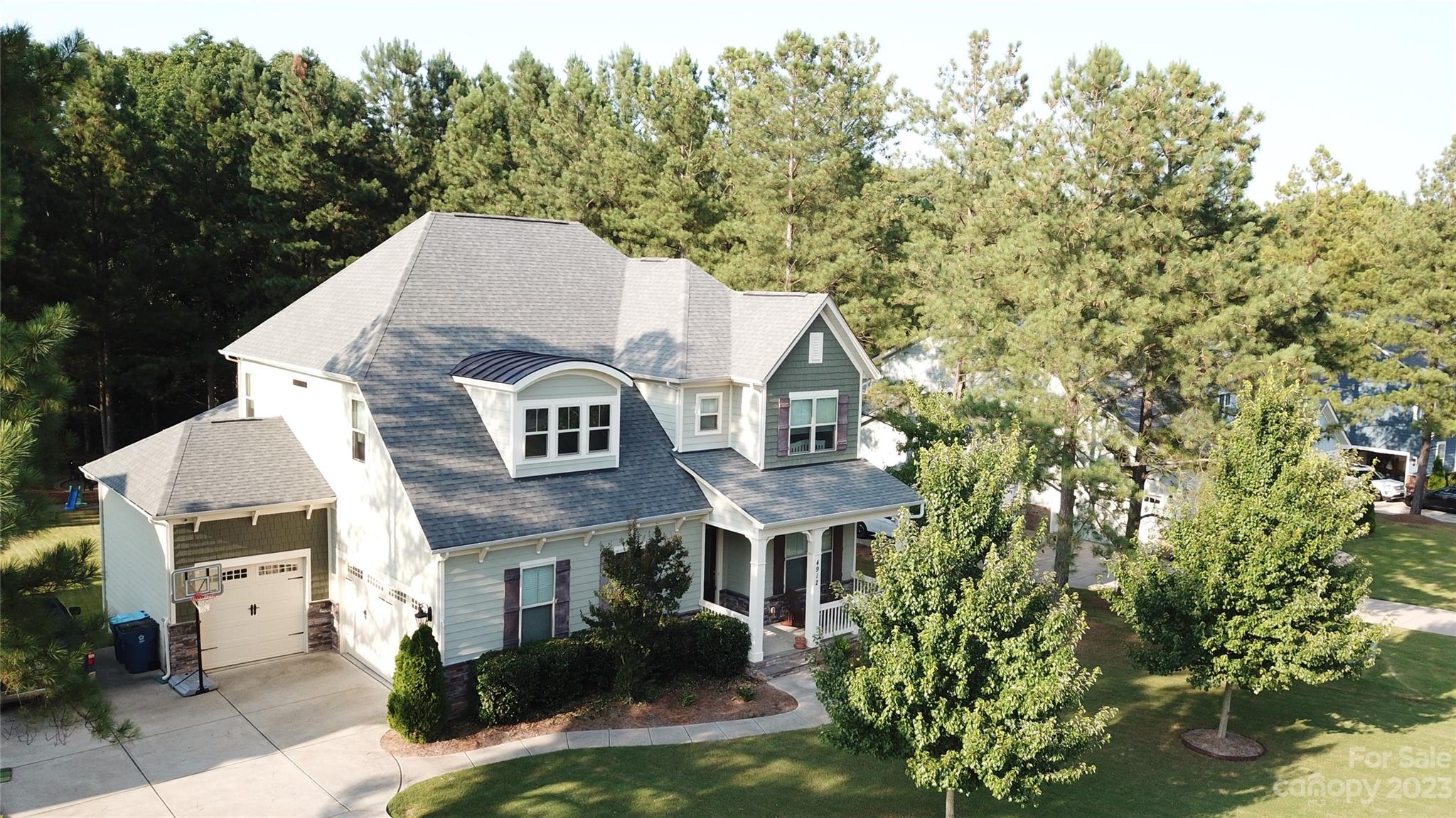 4912 Killian Crossing Drive Denver, NC 28037 - Photo 2 of 38 a front view of a house with a garden