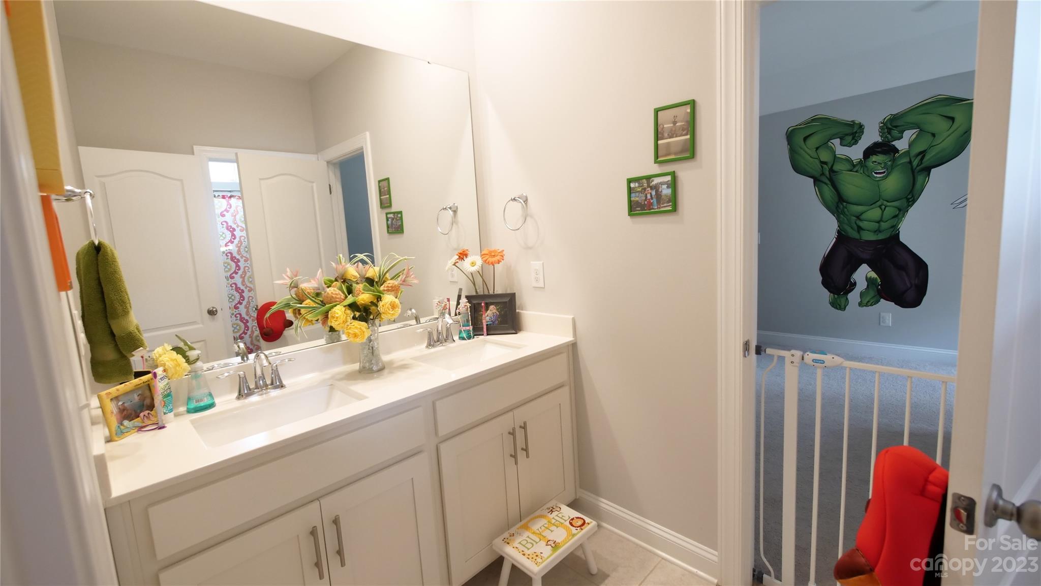 4912 Killian Crossing Drive Denver, NC 28037 - Photo 27 of 38 a bathroom with a sink and a mirror