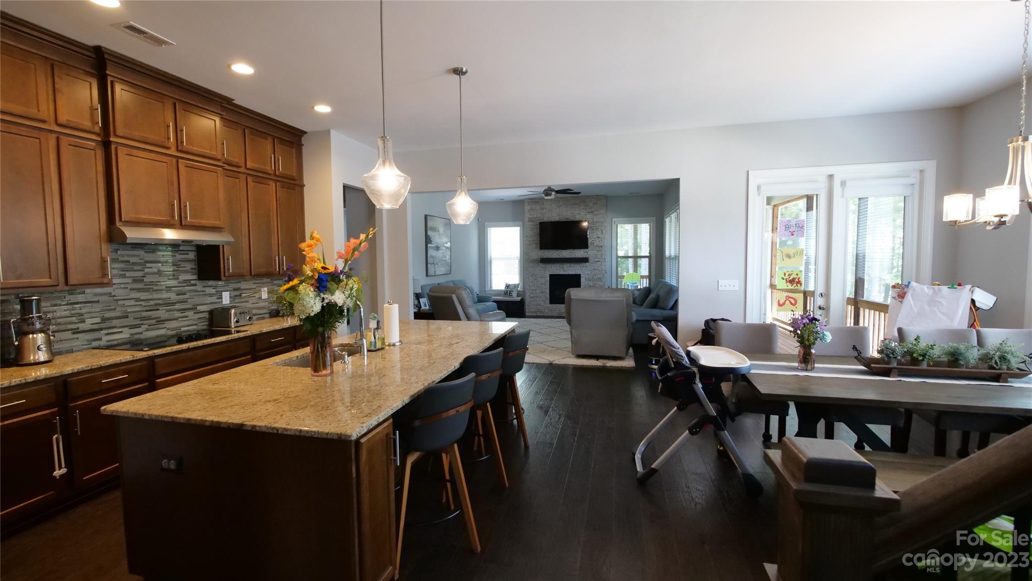 4912 Killian Crossing Drive Denver, NC 28037 - Photo 8 of 38 a kitchen with counter space dining table and chairs