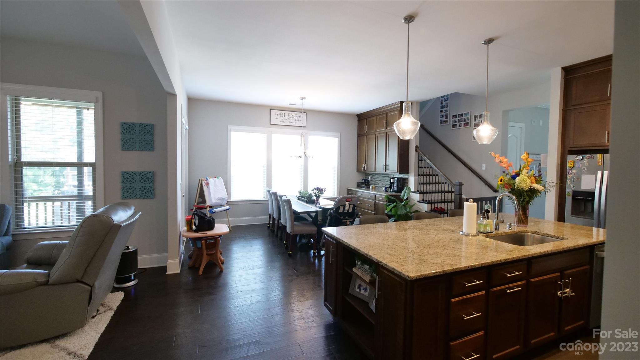 4912 Killian Crossing Drive Denver, NC 28037 - Photo 10 of 38 a kitchen with a stove and a living room