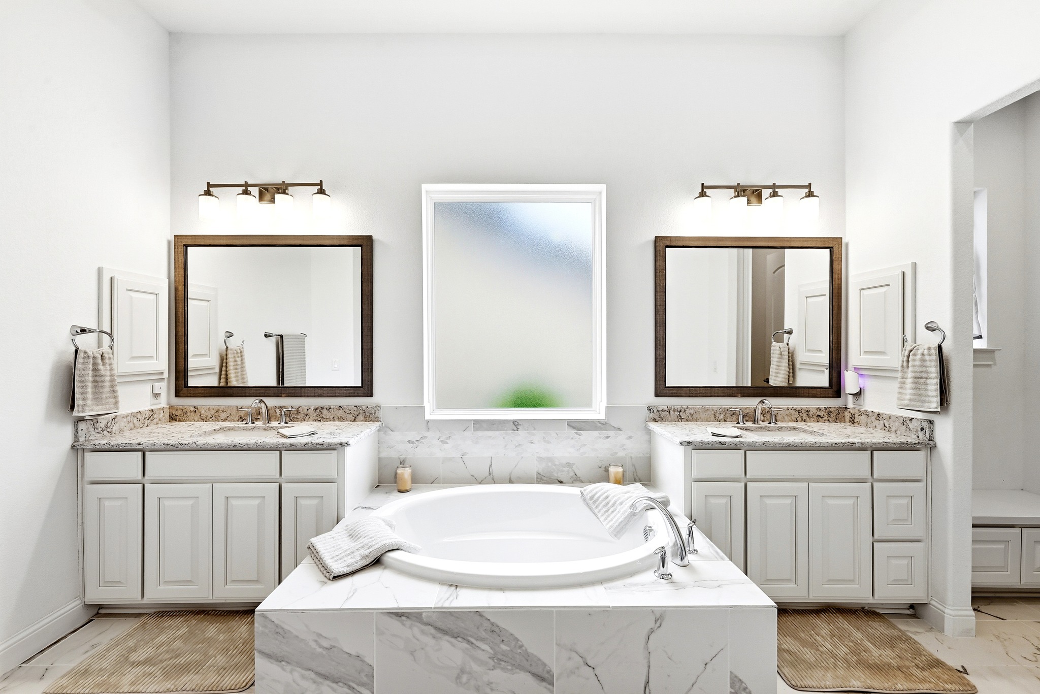4601 Apollonia Way Leander, TX 78641 - Photo 15 of 40 a bathroom with a double vanity sink a mirror and a