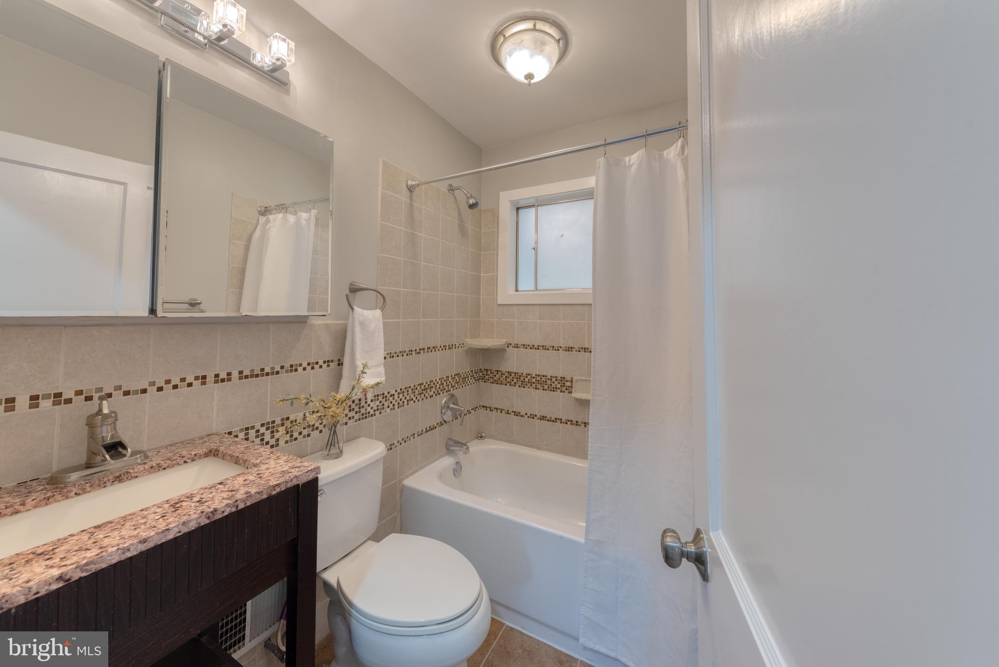 8722 Roper Road Baltimore, MD 21234 - Photo 11 of 23 Ample bath with custom tile and soaking tub