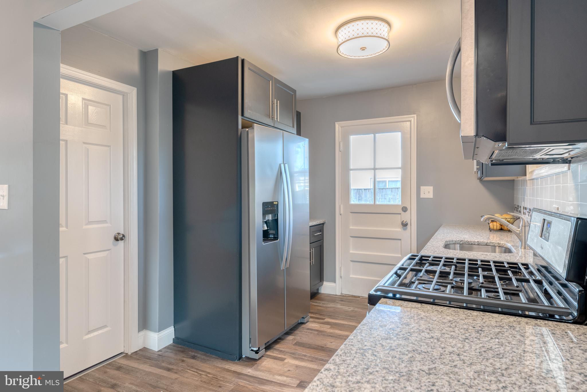 8722 Roper Road Baltimore, MD 21234 - Photo 8 of 23 New SS appliances, gas range, granite tops!